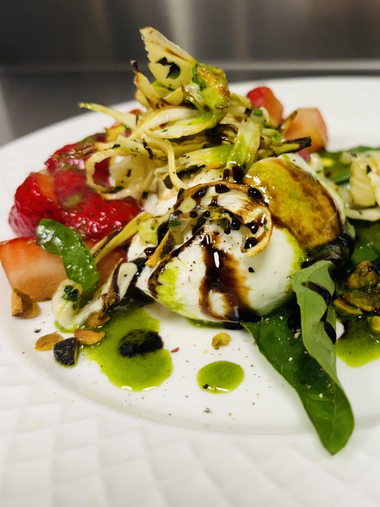 Burrata with strawberry, charred fennel, pistachio and basil oil