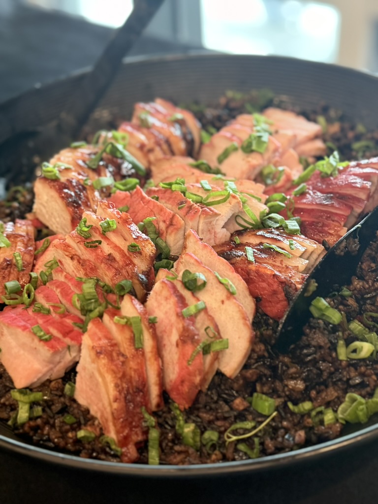Glazed pork over wild rice with scallion