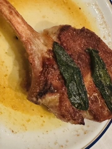 Bone-in pork chop in brown butter with crispy sage