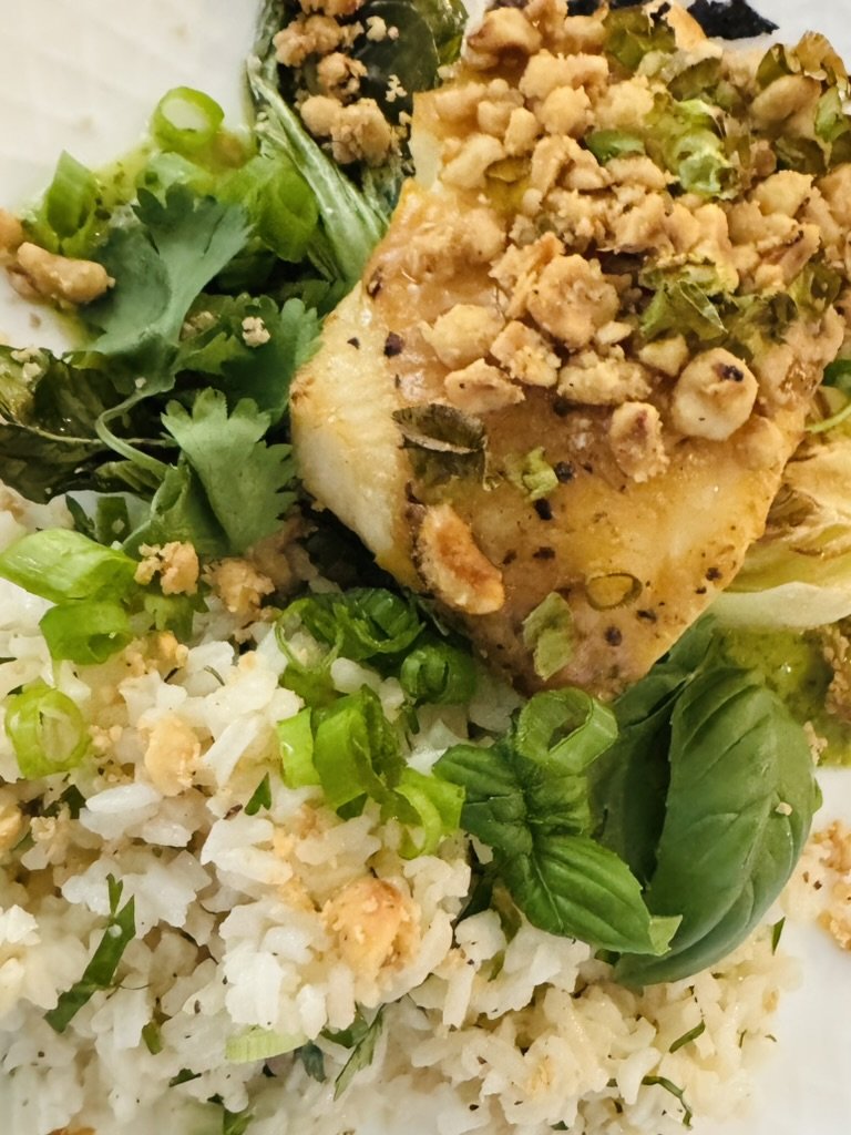 Pan-seared sea bass with peanut crumble over jasmine rice and bok choy